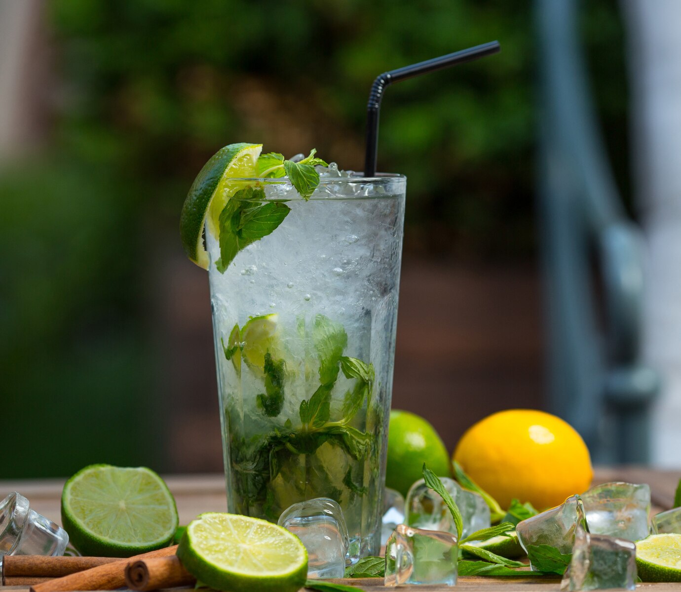 mojito-cocktail-glass-with-ice-pieces-fresh-mint-leaves-and-lime-slices-with-tube_114579-1447.jpg