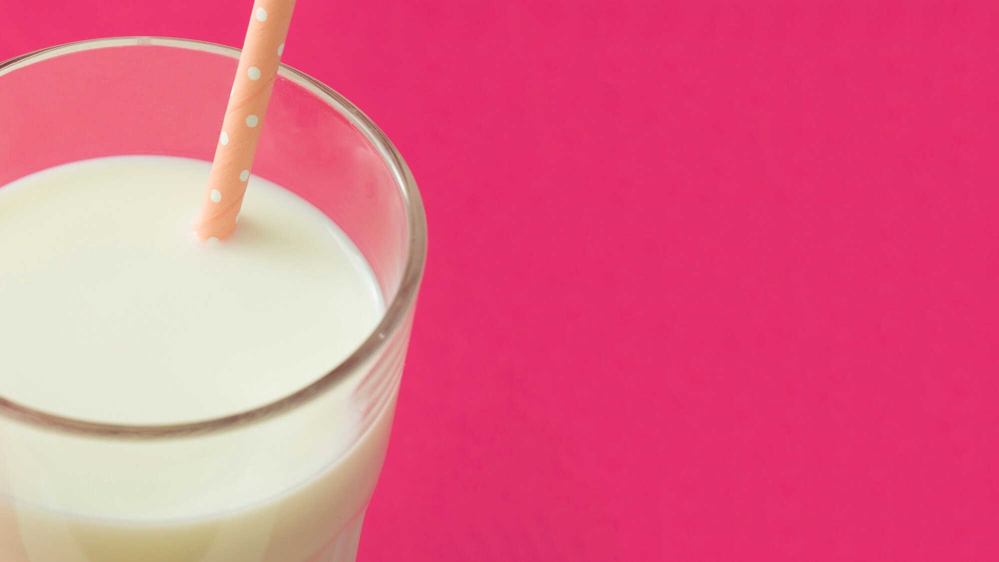 panoramic-view-of-milk-in-the-glass-with-drinking-straw_23-2147872539.jpg